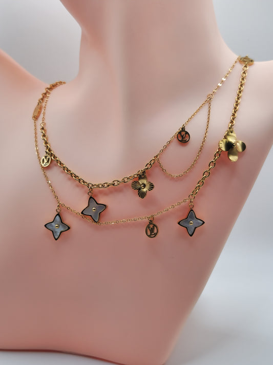 Collier "Éclat Floral Doré" – Multi-rangs à Charms Fleurs et Étoiles